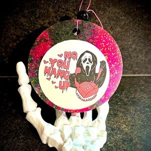 Magnolia blossom scented ghost face car freshie.